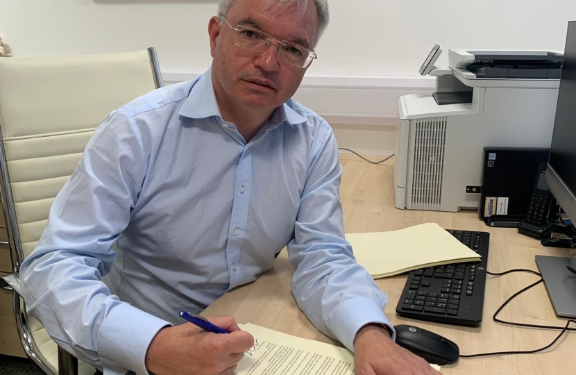 Mark Menzies MP signing letters to residents in flats and new-build homes in Fylde