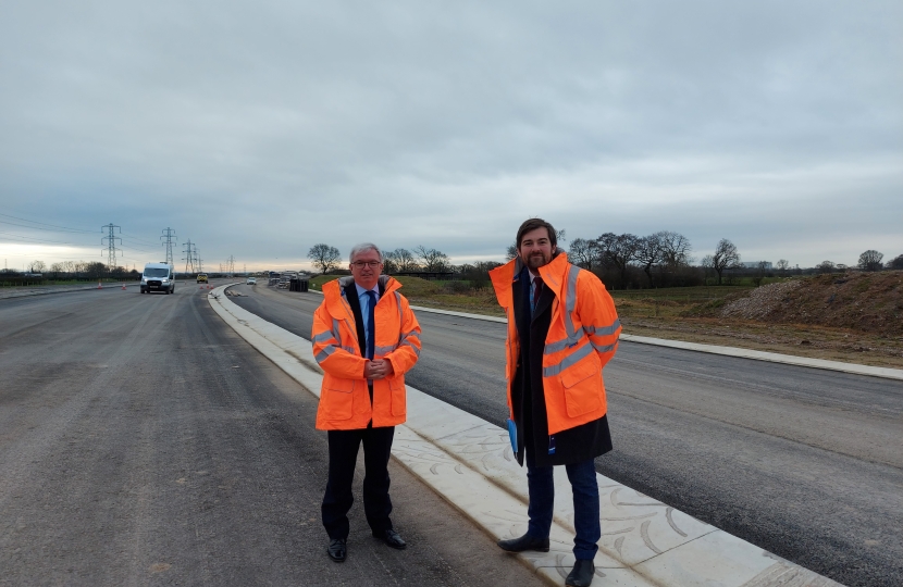 Mark Menzies MP with county councillor Charlie Edwards on the Preston West Distributor road